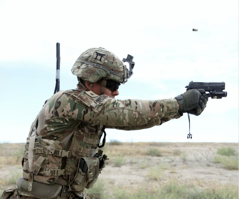 Sgt. Andrew Finneran, a 101st Airborne Division infantryman, fires a Sig Sauer pistol during weapons training May 29, 2015, at Tactical Base Gamberi in eastern Afghanistan.
