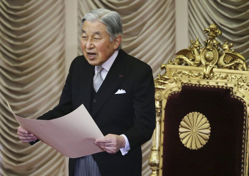FILE - In this Friday, Jan. 20, 2017 file photo, Japan's Emperor Akihito reads a statement to formally open the ordinary Diet session at the upper house of parliament in Tokyo.