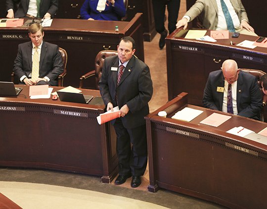 Arkansas Democrat-Gazette/Staton Breidenthal HOUSE ACTION: Republican Rep. Andy Mayberry, standing, of Hensley, gets ready to present HB1032 Monday on the House floor. The bill, which restricts the use of the most common method of second-trimester abortions, passed the House.