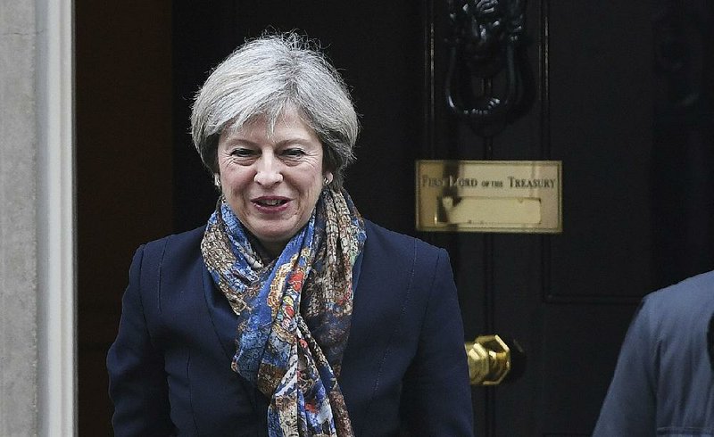 British Prime Minister Theresa May leaves 10 Downing Street in London on Tuesday after Britain’s Supreme Court ruled that parliamentary approval is required for the U.K.’s withdrawal from the European Union. Her office is expected to submit a bill to Parliament as early as this week. 