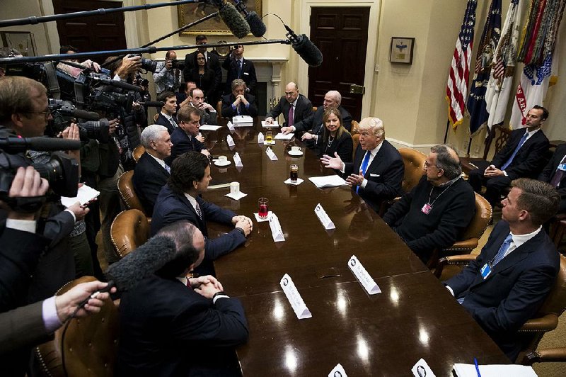 President Donald Trump holds a breakfast meeting with U.S. auto industry leaders Tuesday at the White House. Trump vowed to cut taxes and do away with “unnecessary regulations” to restore America’s manufacturing might.  