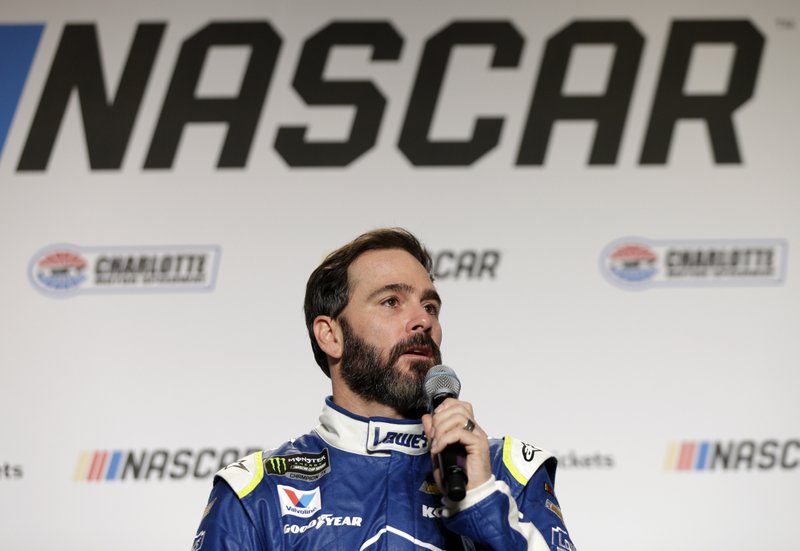 Jimmie Johnson answers a question during a news conference at the NASCAR Media Tour in Charlotte, N.C., Tuesday, Jan. 24, 2017. (AP Photo/Chuck Burton)