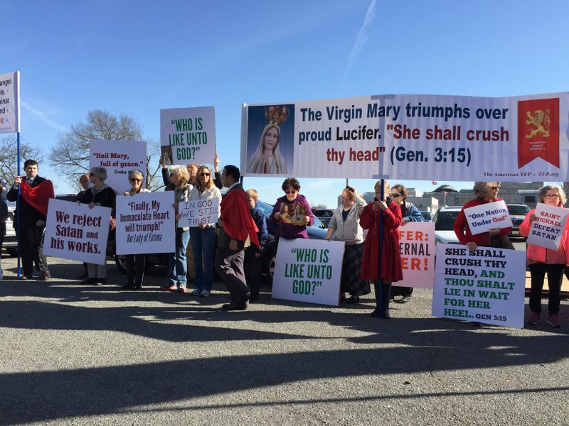 Members of the American Society for the Defense of Tradition, Family and Property, a national Catholic organization, traveled from across Arkansas to gather Wednesday, Jan. 25 in Little Rock to protest against a proposed Satan statue for state grounds. 