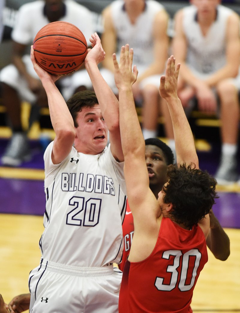 NWA Democrat-Gazette/MICHAEL WOODS @NWAMICHAELW
Caleb Finney (20) of Fayetteville High tries to take a shot over Northside defender Jackson Forsey (30) Tuesday, November 15, 2016 during their game at Fayetteville High School.