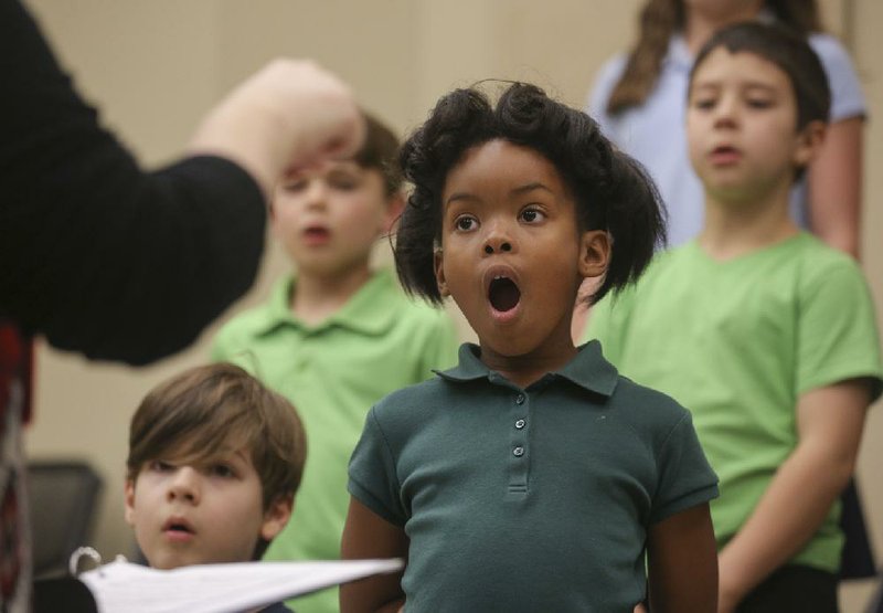 Blaire Gradney and other members of the Interfaith Friendship Children’s Choir practice for a forthcoming concert, to be performed at Second Presbyterian Church in Little Rock on Feb. 26.
