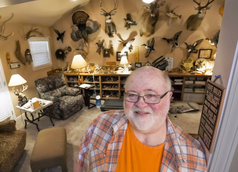 Thurman Booth in his favorite space, his man cave. 