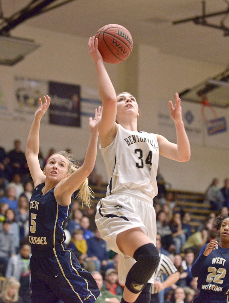 NWA Democrat-Gazette/BEN GOFF @NWABENGOFF Krista Clark (34) of Bentonville High shoots as Emma Wood of Bentonville West defends Friday at Bentonville&#8217;s Tiger Arena.