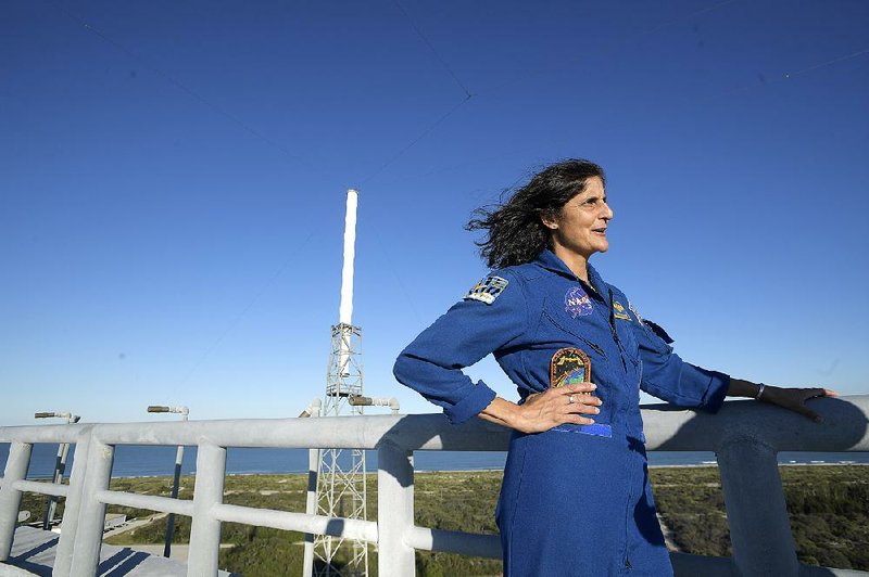 Astronaut Sunita Williams, one of four NASA astronauts chosen to fly on the first commercial spacecraft, stands on the roof of Boeing’s new tower at Launch Complex 41 at Cape Canaveral, Fla.