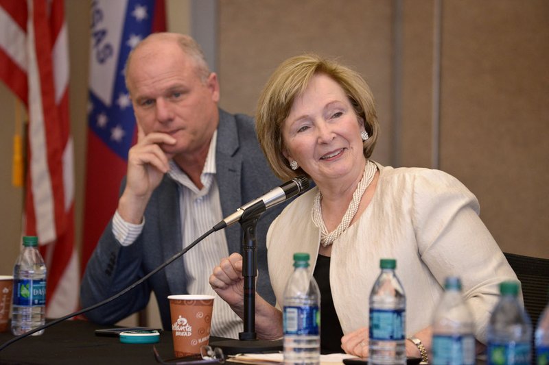 Arkansas state Senators Jim Hendren (left), R-Gravette, and Cecile Bledsoe, R-Rogers, take part in the discussion Saturday during a state legislative forum at the Shewmaker Center for Global Business Development at Northwest Arkansas Community College in Bentonville. The event was the first in a series of public forums that will be hosted by the Rogers-Lowell Area Chamber of Commerce and the Greater Bentonville Chamber of Commerce during the Arkansas General Assembly.