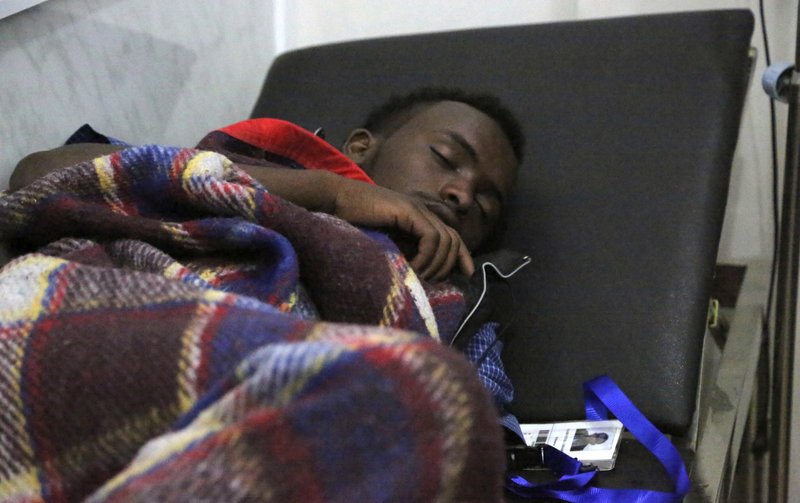 In this Jan. 2, 2017 photo, an Ethiopian migrant lies on a bed at International Organization of Migration center in the port city of Aden, Yemen. 