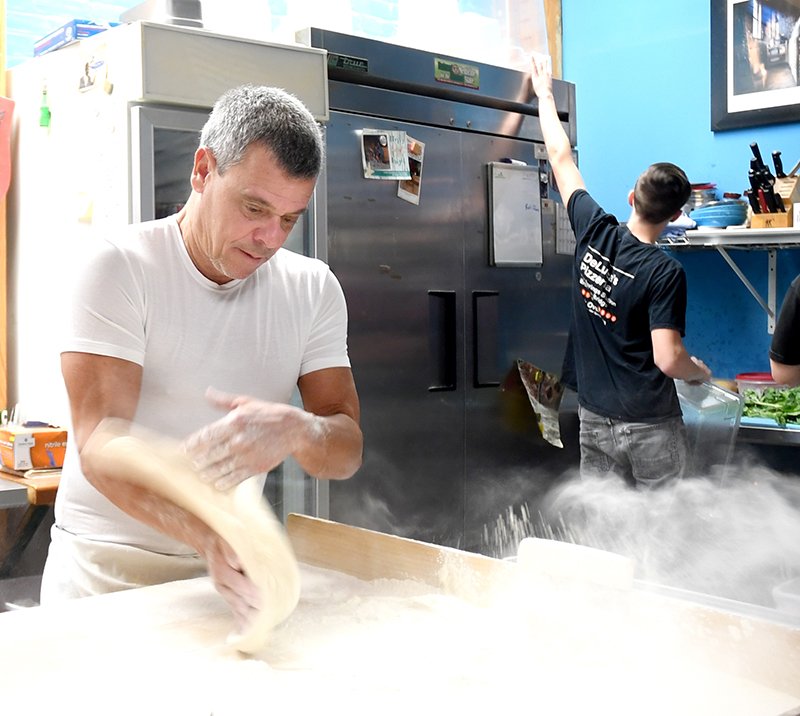 The Sentinel-Record/Mara Kuhn ARTIST AT WORK: Anthony Valinoti, owner and chef at DeLuca's Pizzeria, located at 407 Park Ave., prepares the crust for one of his famous pizzas. His pizza was recently named the best in Arkansas in an article by First We Feast, an online magazine and food blog, which recognized the best pizzas in each of the 50 states.