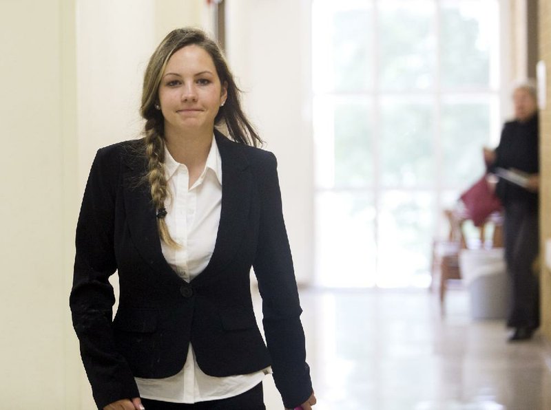 Jennifer Moss walks toward Benton County Circuit Judge Robin Green’s courtroom in Bentonville in July 2016 just before learning the jury’s verdict in her trial over the January 2015 death of her 6-month-old son. She and her ex-husband are serving prison sentences for manslaughter.