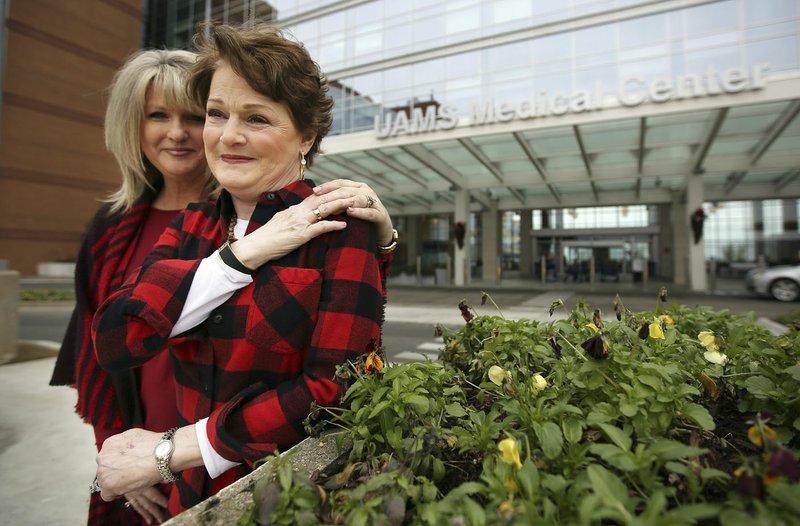 Arkansas Democrat-Gazette/MITCHELL PE MASILUN Tami Hendren, left, and Bke Millwee, have a moment together Jan. 8 in front of UAMS in Little Rock.