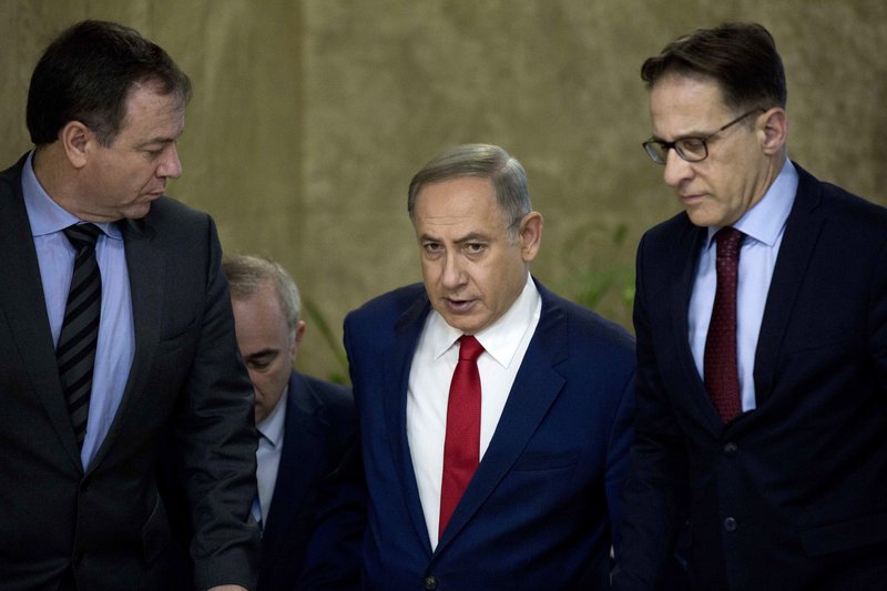Israeli Prime Minister Benjamin Netanyahu (center) arrives for his weekly Cabinet meeting in Jerusalem on Sunday.