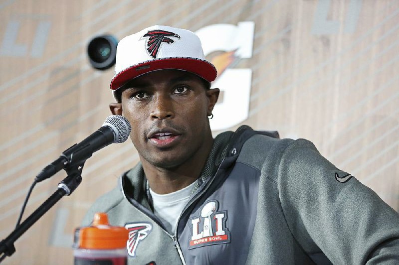 Atlanta wide receiver Julio Jones speaks with reporters during Super Bowl media day Monday. Jones caught 83 passes for 1,409 yards and 6 touchdowns this season for the Falcons, who are 3-point underdogs going into Sunday’s game against New England.