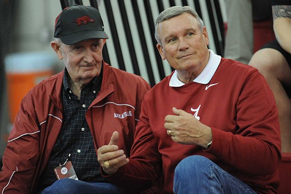 Former Arkansas coaches John McDonnell (left) and Dick Booth speak during the Tyson Invitational Saturday, Feb. 14, 2015, at the Randal Tyson Track Center in Fayetteville.