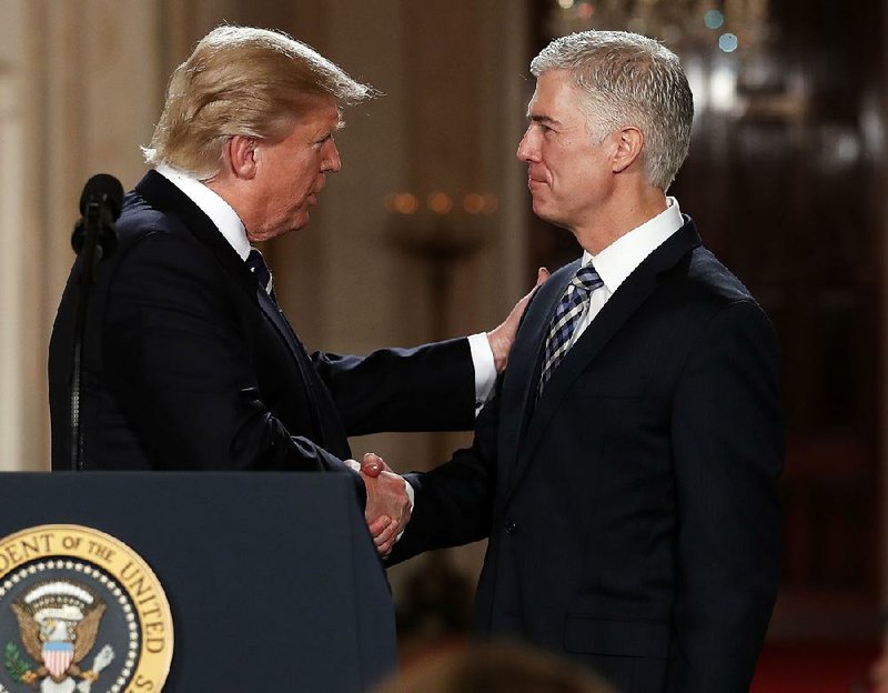 President Donald Trump congratulates Judge Neil Gorsuch of the 10th Circuit Court of Appeals after nominating him to the Supreme Court. At 49, Gorsuch is the youngest nominee to the court in 25 years.