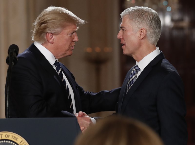 President Donald Trump shakes hands with 10th U.S. Circuit Court of Appeals Judge Neil Gorsuch, his choice for Supreme Court Justices in the East Room of the White House in Washington, Tuesday, Jan. 31, 2017. (AP Photo/Carolyn Kaster)