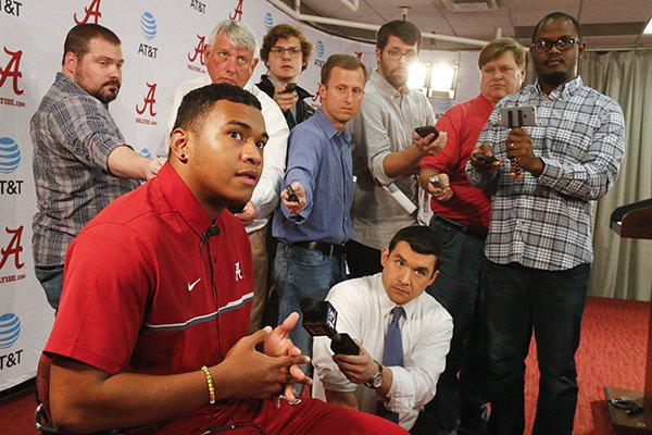 Highly touted quarterback recruit Tua Tagovailoa speaks to the media during a news conference announcing the recruiting class for the University of Alabama in Tuscaloosa, Ala., Wednesday, Feb. 1, 2017. Tagovailoa is one of the players who took advantage of early enrollment. (Gary Cosby Jr./The Tuscaloosa News via AP)

