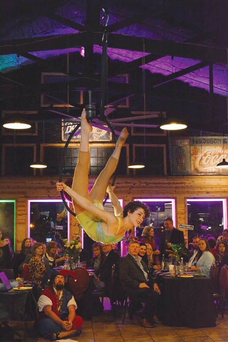 Anna Micklea with Orenda Entertainment in Fayetteville performs aerial acrobatics for the crowd at the Batesville Area Chamber of Commerce’s annual meeting and gala.