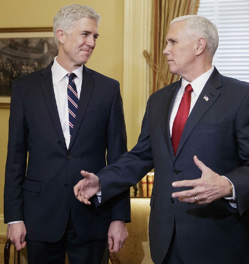 Federal Judge Neil Gorsuch (left) and Vice President Mike Pence visit Senate Majority Leader Mitch McConnell’s office Wednesday as the Supreme Court nominee made courtesy calls on Capitol Hill.