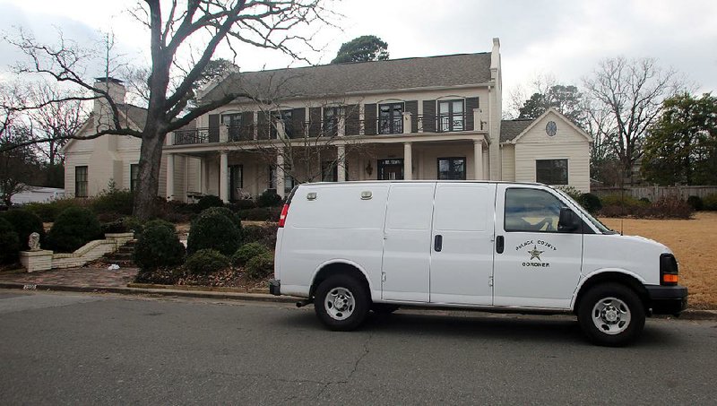 Pulaski County coroner’s van is parked Wednesday afternoon in front of 2900 N. Taylor St. in Little Rock.