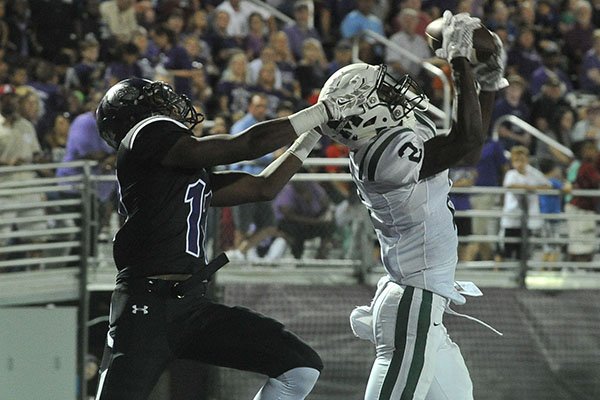 Muskogee's Kamren Curl intercepts a pass in front of a Fayetteville receiver on Friday, Sept. 18, 2015, at Harmon Field in Fayetteville. 