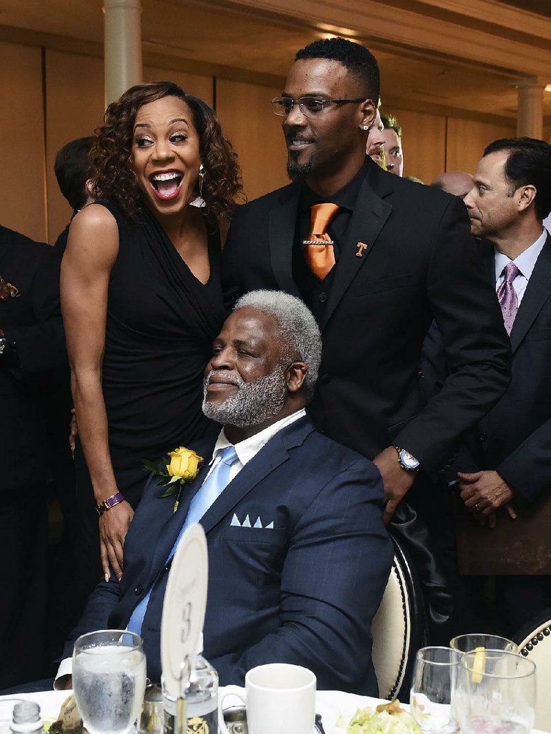 Earl Campbell (seated) joins Olympic gold medalist Sanya Richards-Ross and former NFL player Aaron Ross during the Earl Campbell Tyler Rose Award ceremony in Tyler, Texas, last month. 