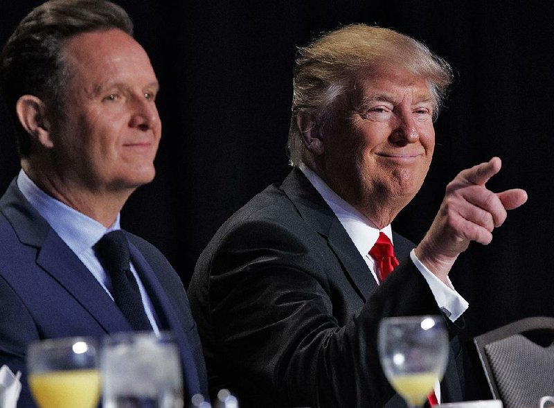 President Donald Trump is joined by television producer Mark Burnett at the National Prayer Breakfast on Thursday in Washington. Burnett introduced the president. 