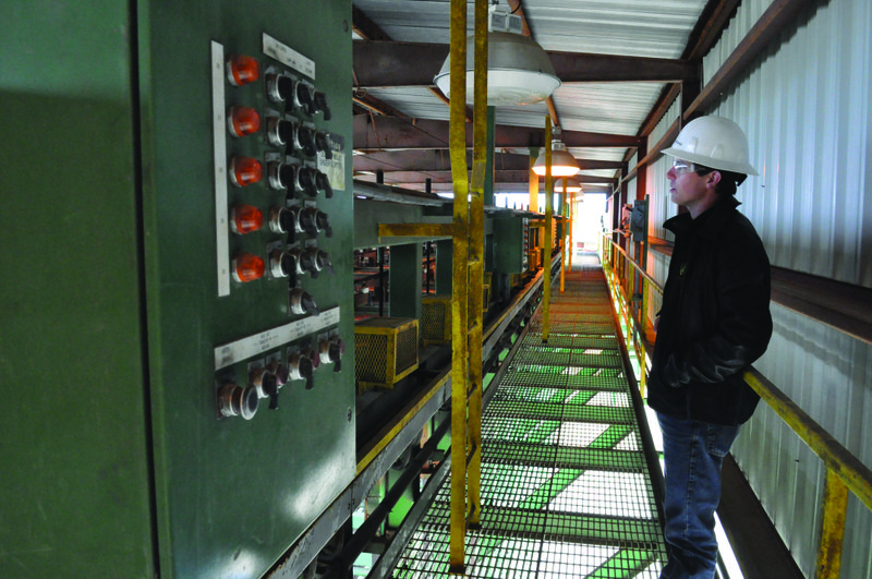 FILE — Engineer Zachary Strahan walks through the former Georgia-Pacific sawmill in this 2017 file photo.