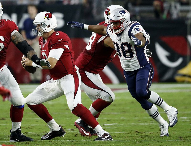 Trey Flowers (right) of the New England Patriots has been disruptive this season at both defensive end and as an undersized interior lineman. The former Arkansas Razorback led the Patriots with seven sacks during the regular season and will play in his first Super Bowl on Sunday.