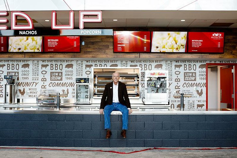 Rich McKay, president of the Atlanta Falcons, is shown in a food stand under construction at Mercedes-Benz Stadium, opening next season, in Atlanta.