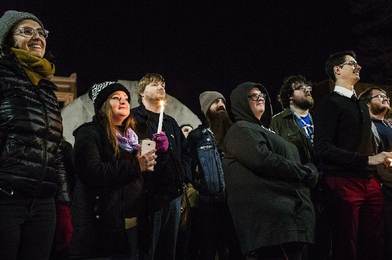 People gather Friday in a park in Bowling Green, Ky., for a tonguein-cheek remembrance of the “Bowling Green massacre.”