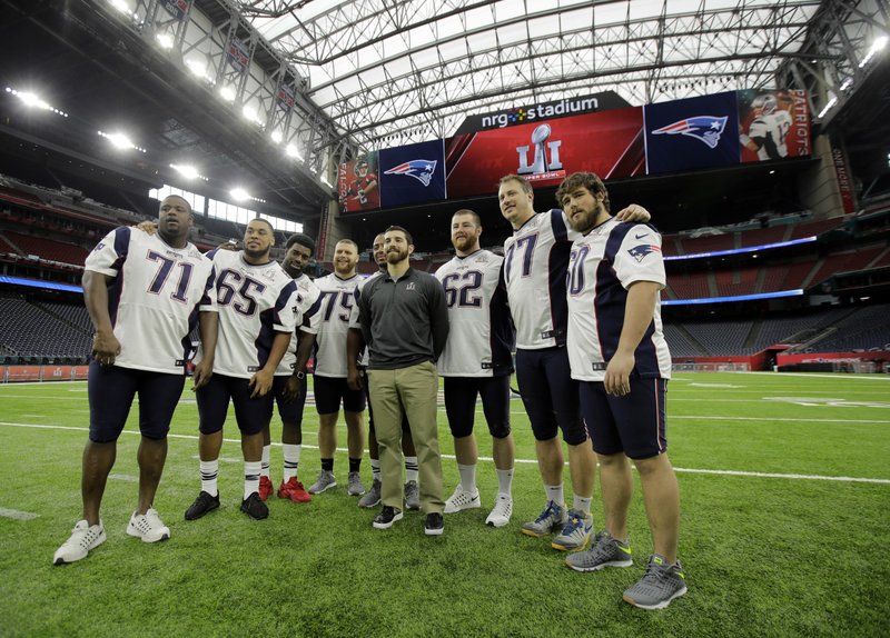 New England Patriots players pose for a photo during a walk through at NRG Stadium, site of the NFL Super Bowl 51 football game, Saturday, Feb. 4, 2017, in Houston. The Patriots will face the Atlanta Falcons in the Super Bowl Sunday. 