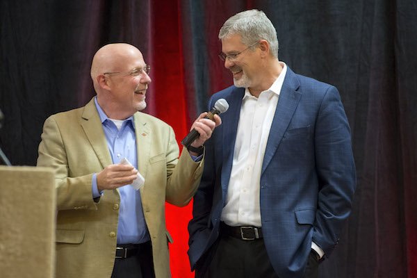 Chuck Barrett (left) talks with Arkansas defensive coordinator Paul Rhoads on Thursday, Feb. 2, 2017, on the team's signing day results during the Northwest Arkansas Razorback Club Signing on the Hill event at the Holiday Inn & Convention Center in Springdale.