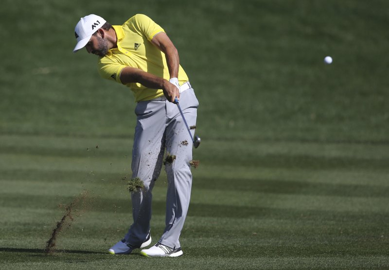 Sergio Garcia of Spain plays a shot on the 9th hole during the final round of the Dubai Desert Classic golf tournament in Dubai, United Arab Emirates, Sunday, Feb. 5, 2017. 