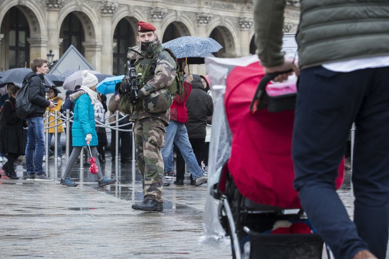 A French soldier patrols in the courtyard of the Louvre museum in Paris, Saturday, Feb. 4, 2017. The Louvre in Paris reopened to the public Saturday morning, less than 24-hours after a machete-wielding assailant shouting &quot;Allahu Akbar!&quot; was shot by soldiers, in what officials described as a suspected terror attack.