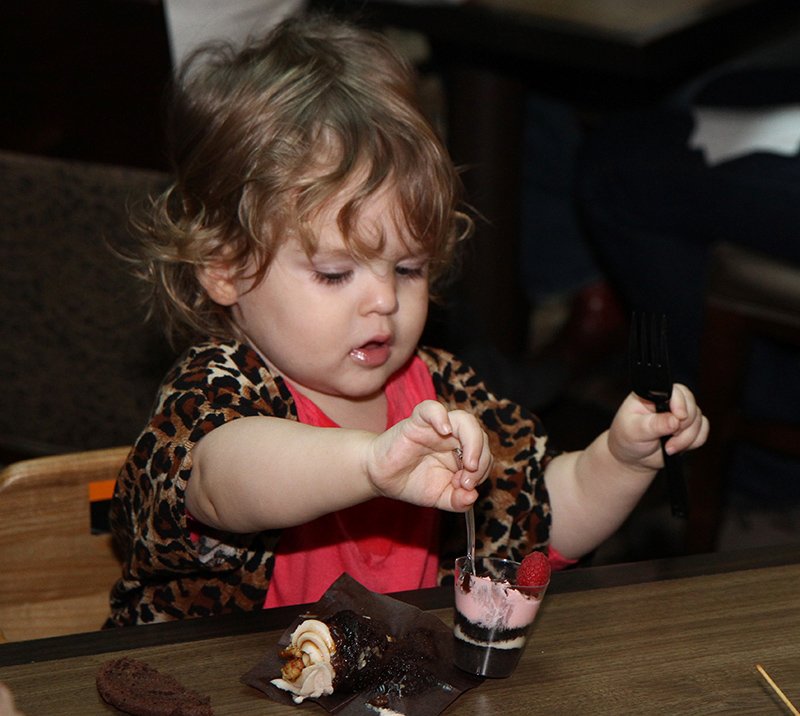 The Sentinel-Record/Lorien E. Dahl SWEET TOOTH: Elizabeth Winningham, 1, of Cabot, enjoys treats during the 13th annual Chocolate Festival Sunday afternoon.