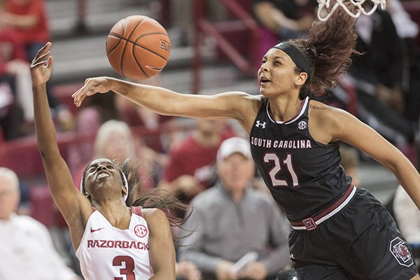 Arkansas' Malica Monk gets her shot blocked by South Carolina's Mikah Harrigan during a game Sunday Feb. 5, 2017, at Bud Walton Arena in Fayetteville. South Carolina won 79-49.