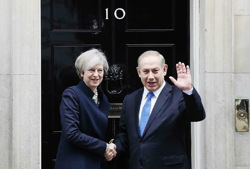 British Prime Minister Theresa May greets Israeli counterpart Benjamin Netanyahu on Monday at 10 Downing St. in London.
