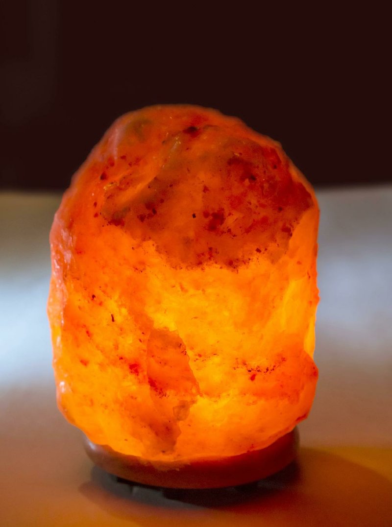 A salt lamp emits a beautiful glow, but it’s hard to shed light on claims that a lamp like this can make a person feel better and brighter.