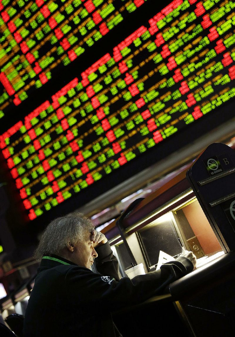 A patron looks over his bets at a Las Vegas sportsbook before last season’s Super Bowl. A record $138.5 million was wagered on Super Bowl LI at Nevada sportsbooks.