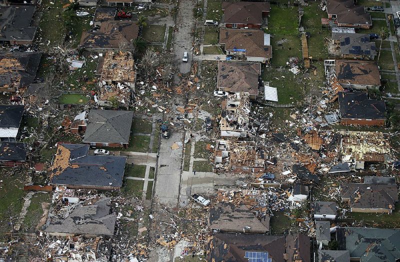 Louisiana Gov. John Bel Edwards viewed from the air Tuesday the tornado damage in this eastern neighborhood of New Orleans. He declared a state of emergency for the state’s southeast. 