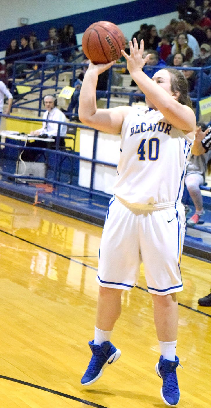 Photo by Mike Eckels Cameron Shaffer (Decatur 40) puts up a three-point shot from the left wing during the Lady Bulldogs&#8217; 69-21 victory against the Lady Highlanders of Eureka Springs at Peterson Gym in Decatur on Feb. 3. Shaffer&#8217;s 13-points contributed to the Lady Bulldogs&#8217; final home victory of the 2016-17 season.