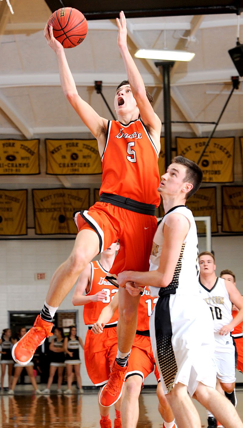 Photo by Andy Shupe Dayten Wishon, Gravette junior, went up for a shot under the basket in play against West Fork in the Tiger Dome on Tuesday, Jan. 31, 2017.