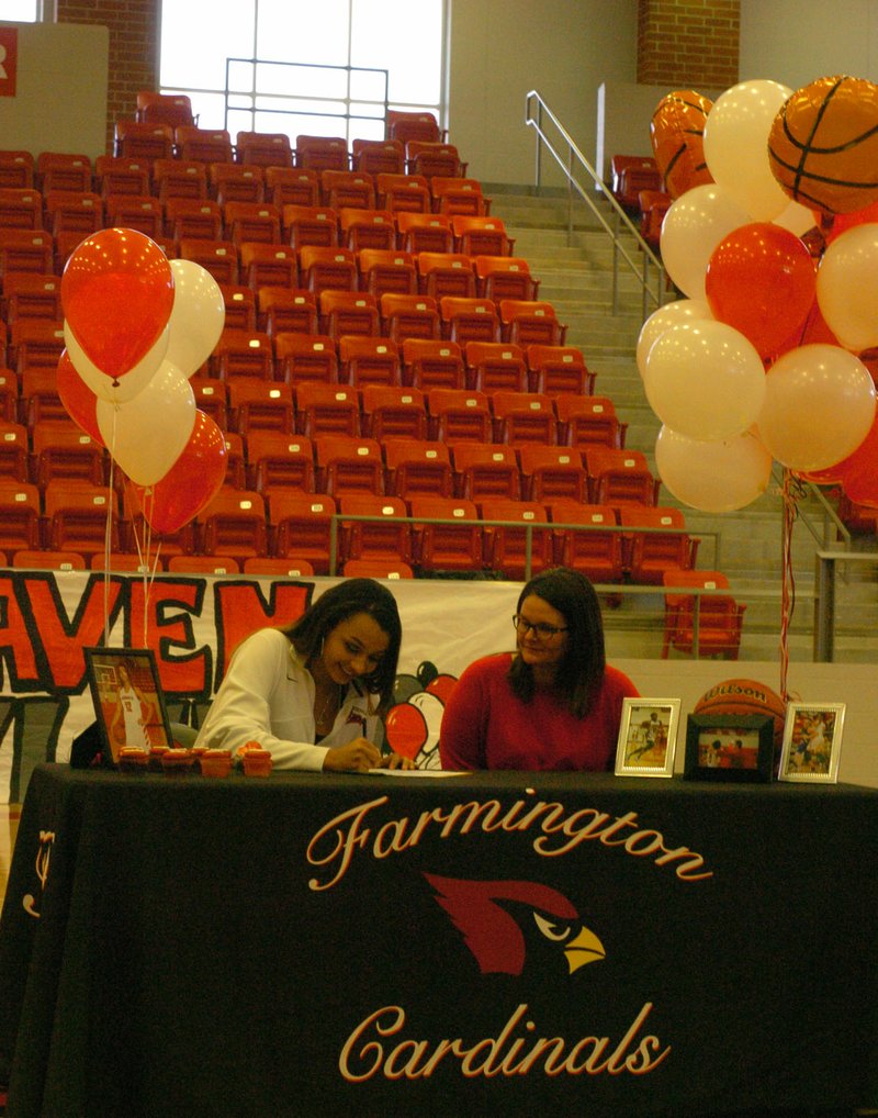 MARK HUMPHREY ENTERPRISE-LEADER Farmington senior Kaylee Brown, accompanied by her mother, Melissa Allen, signs a national letter of intent to play women&#8217;s college basketball for Coffeyville Junior College, of Coffeyville, Kan. Feb 1 at Cardinal Arena.