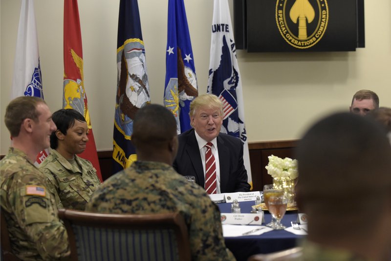 President Donald Trump has lunch with troops while visiting U.S. Central Command and U.S. Special Operations Command at MacDill Air Force Base, Fla., Monday, Feb. 6, 2017. Trump, who spent the weekend at Mar-a-Lago, stopped for a visit to the headquarters before returning to Washington. (AP Photo/Susan Walsh)