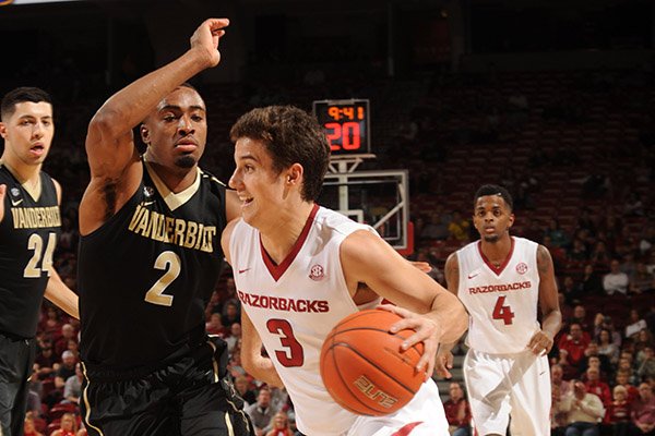 Arkansas guard Dusty Hannahs (3) drives to the basket as Vanderbilt wing Joe Toye (2) defends Tuesday, Feb. 7, 2017, during the second half of play in Bud Walton Arena in Fayetteville.