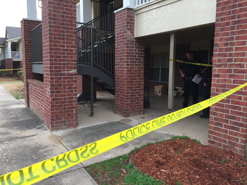 Crime scene tape blocks an apartment on Par Drive where multiple people were shot, including one fatally, authorities said.