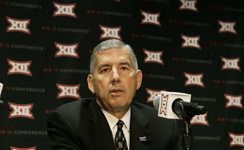 In this Oct. 17, 2016 file photo, Big 12 Commissioner Bob Bowlsby speaks to reporters after The Big 12 Conference meeting in Grapevine, Texas.  